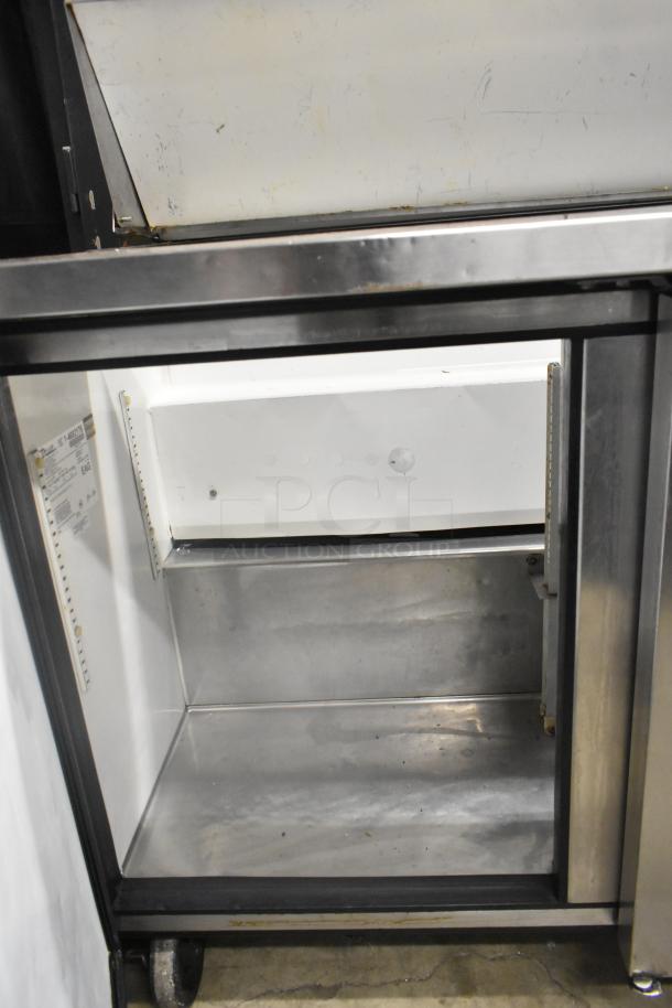 True TSSU-72-16 prep table with stainless steel interior, commercial casters, 115 volts, 1 phase. Clean interior, used condition.