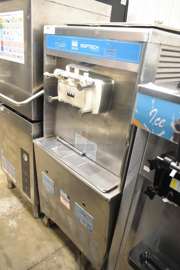 Taylor 754-27 stainless steel 2-flavor soft serve machine, floor style; used, 208-230V, 1 phase, with twist feature.