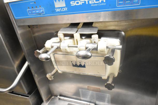 Taylor 754-27 stainless steel soft serve machine, 2 flavor with twist, 208-230V, 1 phase. Visible brand label.