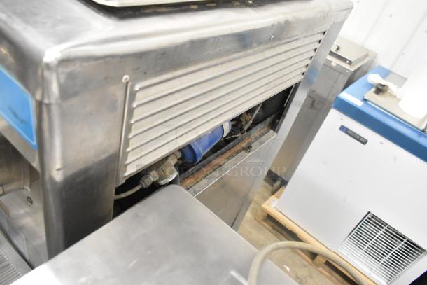 Taylor 754-27 stainless steel soft serve machine, dual flavor with twist. Visible wear, for commercial use, 208-230V, 1 phase.