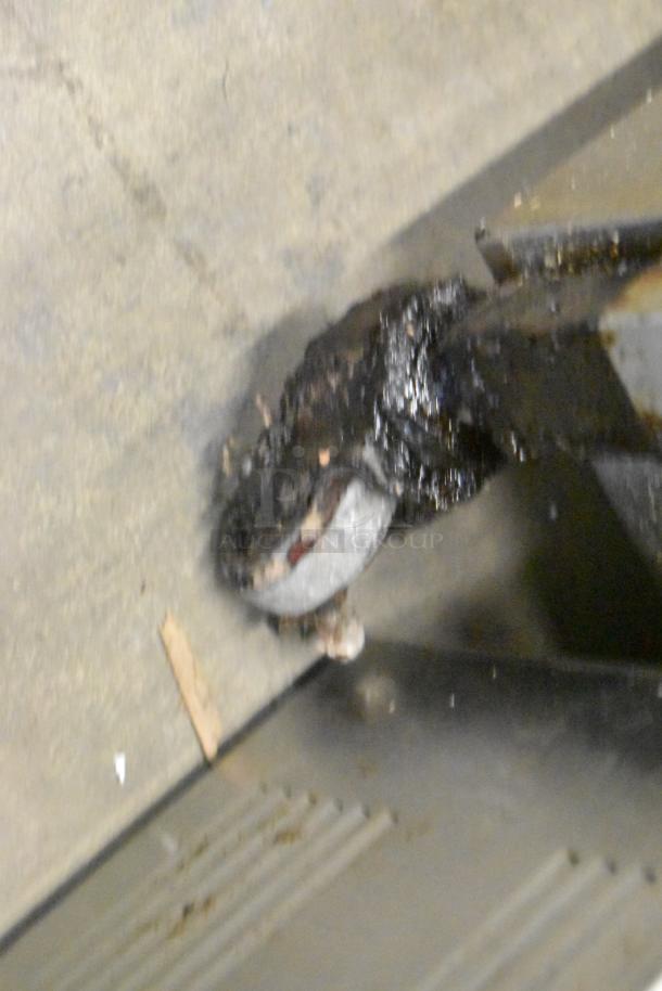 Henny Penny 600 pressure fryer, stainless steel, on casters, 80,000 BTU, some visible wear, commercial use.
