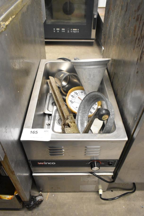 Two stainless steel food warmers, Winco FW-S600 and Avantco, 115 volts, 1 phase, showing used condition, control knob visible.