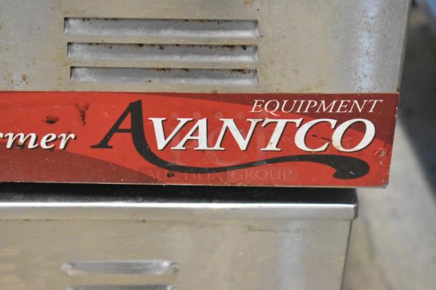 Two stainless steel food warmers, Winco FW-S600 and Avantco. 115 volts, 1 phase. Avantco label visible.