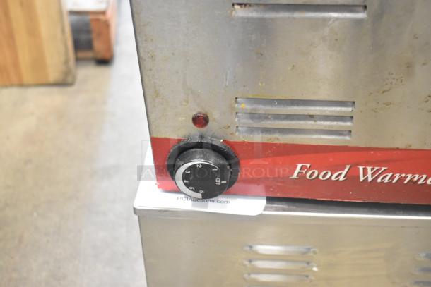 Two stainless steel food warmers, models Winco FW-S600 and Avantco, 115 volts, 1 phase, dial control visible.