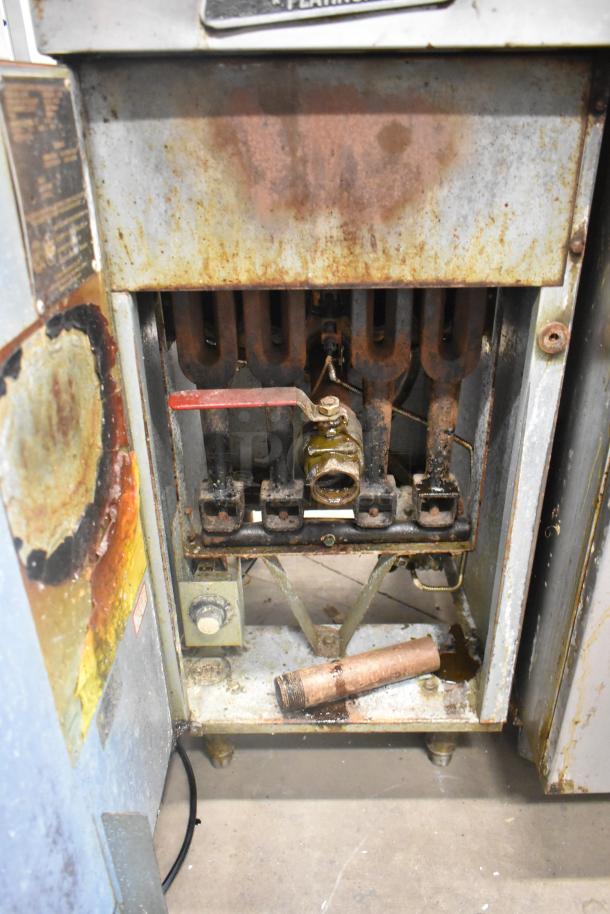 Sir Lawrence LG400 stainless steel natural gas deep fat fryer, 120,000 BTU, worn condition with rust, interior components visible.