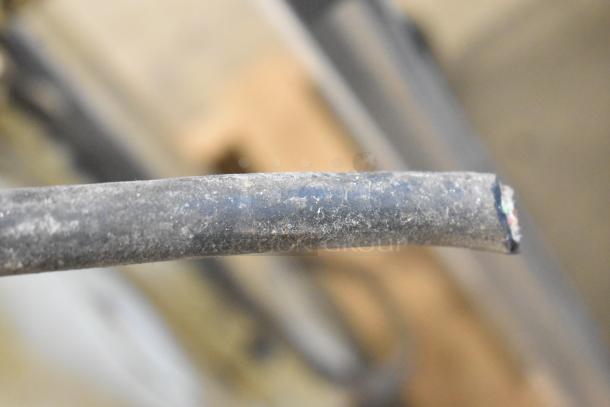 Fortuna Metal Commercial Floor Style Dough Divider, showing a damaged cable end, indicating wear.