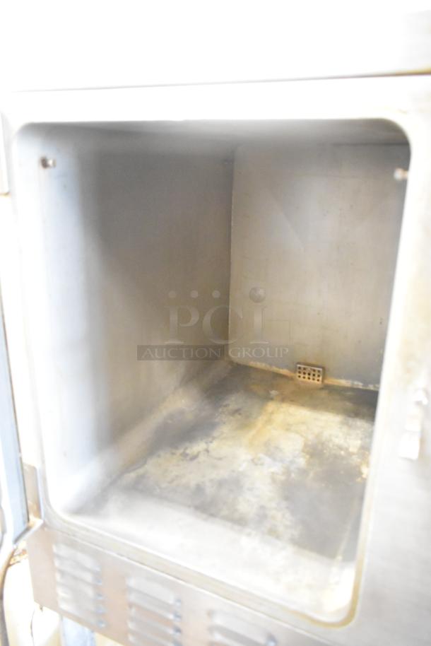 Hobart HC24EA5 stainless steel steam cabinet, interior view, showing wear. Electric, 208/240V, 3/1 Phase, commercial use.