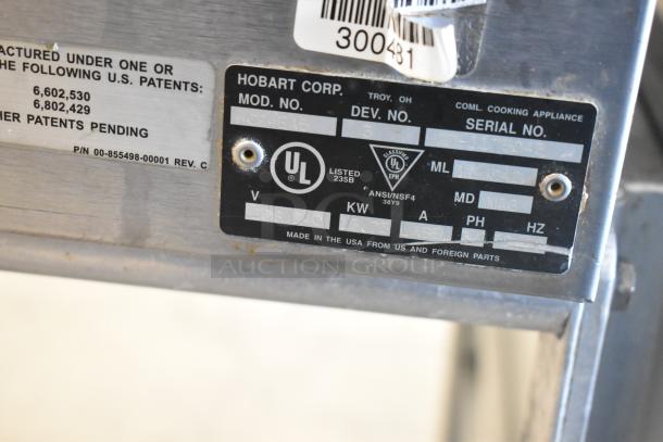 Hobart HC24EA5 steam cabinet label showing model, serial number, UL certification, and voltage information.