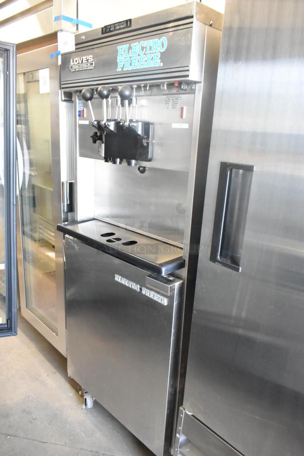 Electro Freeze 30TNCAB-213 stainless steel 2-flavor soft serve ice cream machine with twist, on casters. 230V, 1-phase.