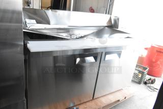 Brand new Avantco 178APT60MHC stainless steel commercial prep table with dents. Mega top design, 115V, 1 phase.