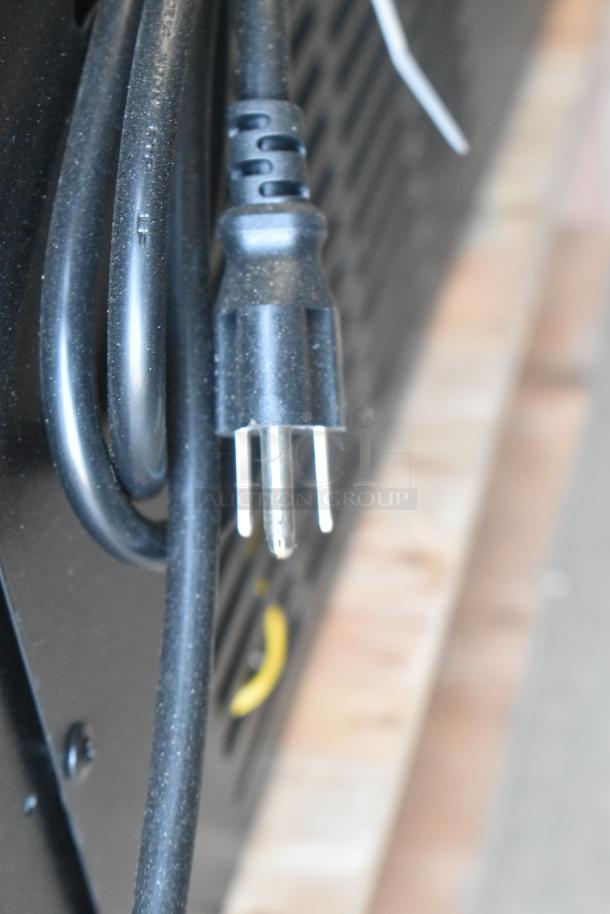 Close-up image of a power plug attached to the Avantco 178APT60MHC prep table, showing a black cable and standard plug.