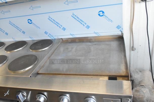 Imperial stainless steel 6-burner hot plate with right-side griddle, 2 ovens, over shelf, and backsplash. Commercial quality.