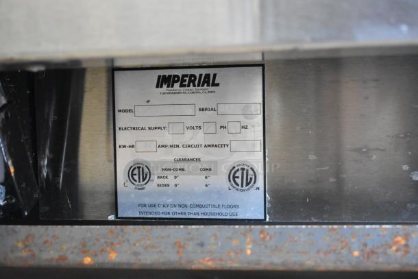 Imperial stainless steel commercial range label showing model, serial number, and electrical specifications.