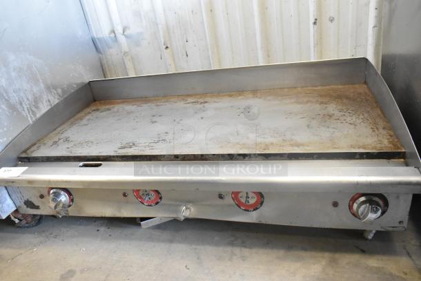 Star stainless steel commercial countertop flat top griddle with thermostatic controls. Mild wear, clean surface, sturdy build.