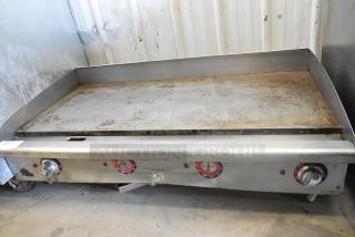 Star stainless steel commercial countertop flat top griddle with thermostatic controls. Mild wear, clean surface, sturdy build.