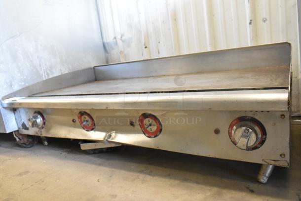 Star stainless steel commercial countertop flat top griddle with thermostatic controls, shows some wear.