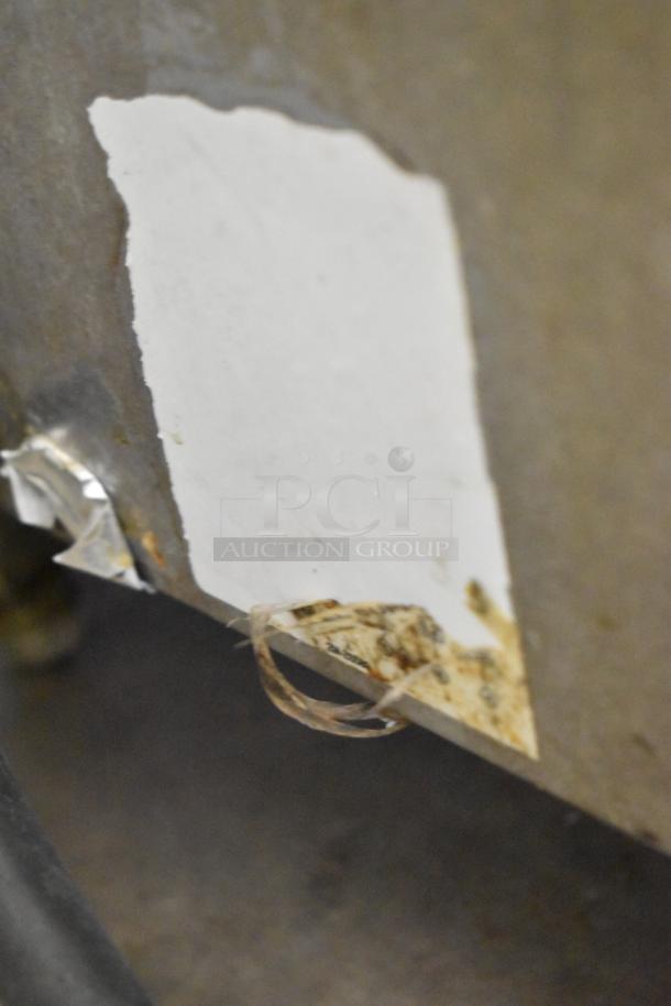 Star stainless steel commercial countertop flat top griddle with thermostatic controls, shows signs of wear and incomplete label.