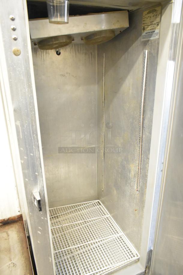 Continental 1FE stainless steel commercial single door reach-in freezer, interior view, 115 volts, 1 phase, used condition.