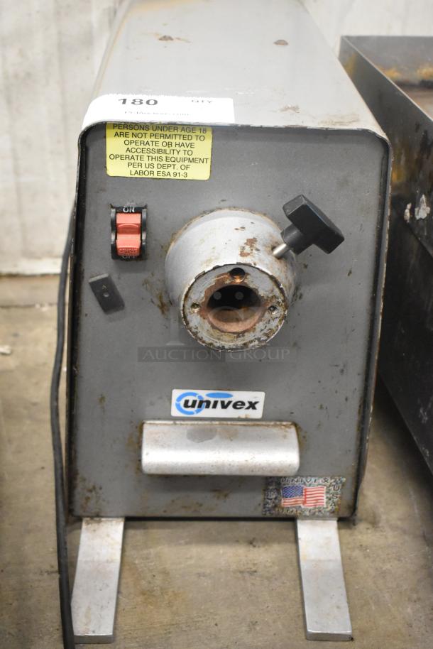 Univex PM91 metal commercial countertop meat grinder, 115 volts, 1 phase, with visible wear and safety label.