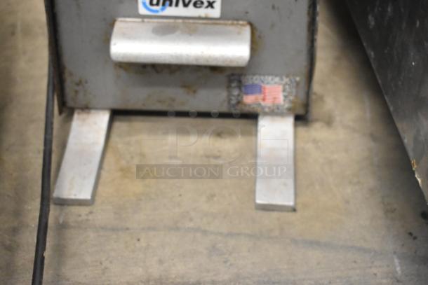 Univex PM91 Metal Commercial Meat Grinder, visible wear, 115V, 1 Phase. Univex logo and American flag sticker shown.