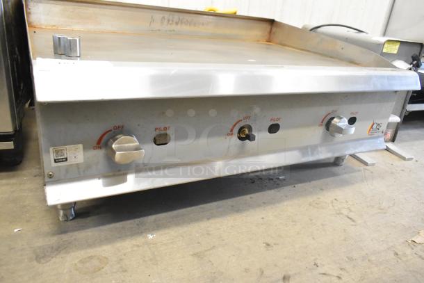2023 CPG 351GMCPG36NL stainless steel flat top griddle, 90,000 BTU, natural gas, knobs labeled on/pilot.
