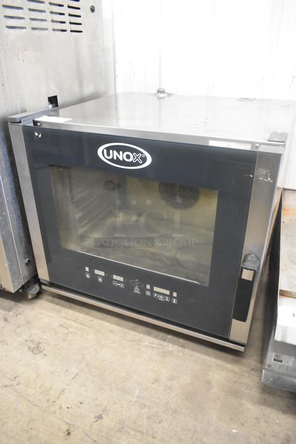Cadco Unox XAV305 stainless steel convection oven, 208-240V, in used condition. Front control panel with visible brand logo.