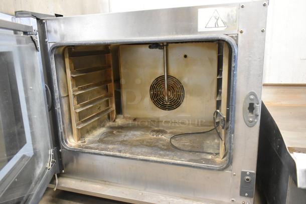 Cadco Unox XAV305 Commercial Convection Oven, stainless steel, electric, 208-240V. Used condition, visible interior details.