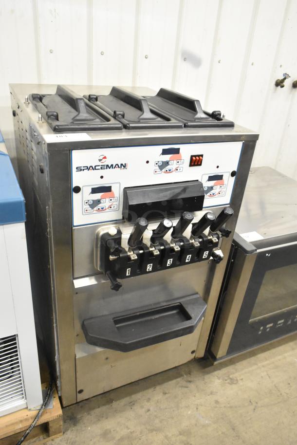 Spaceman Forte 6265W stainless steel 3-flavor soft serve ice cream machine with twist feature on casters, 220V, 1 Phase.