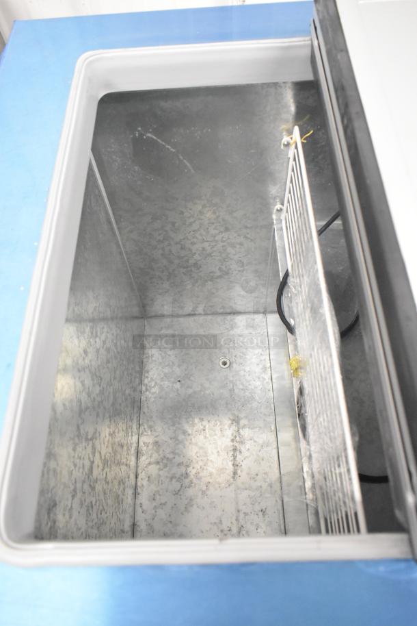Brand new 2022 Master-Bilt DC-4D metal commercial chest freezer, 115 volts, 1 phase, interior view shown.