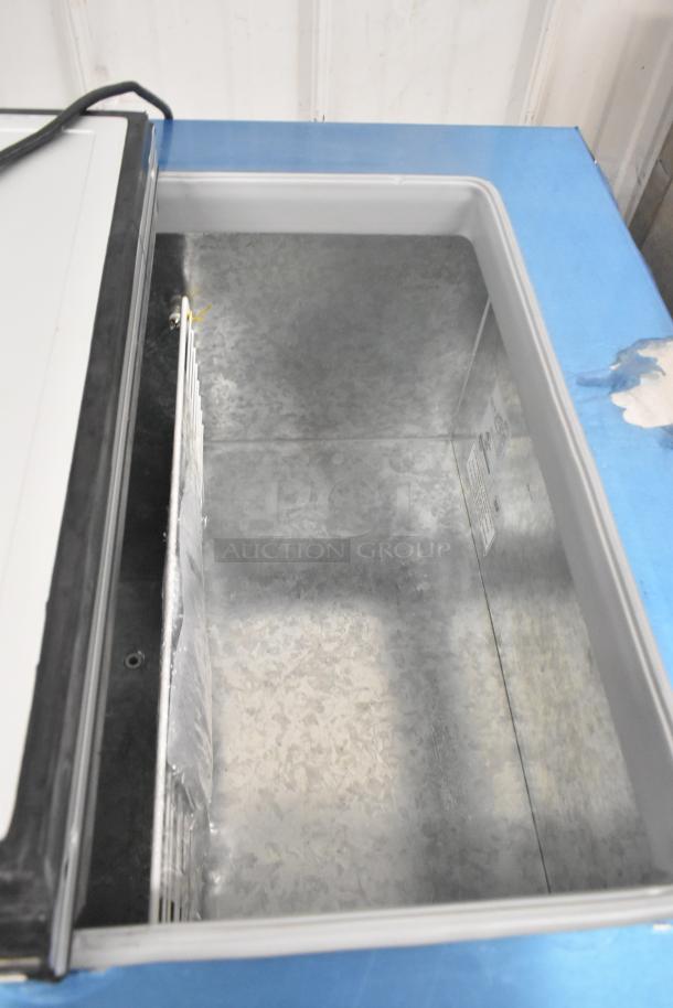 Brand new 2022 Master-Bilt DC-4D metal commercial chest freezer, 115 volts, 1 phase. Open view showing interior space.