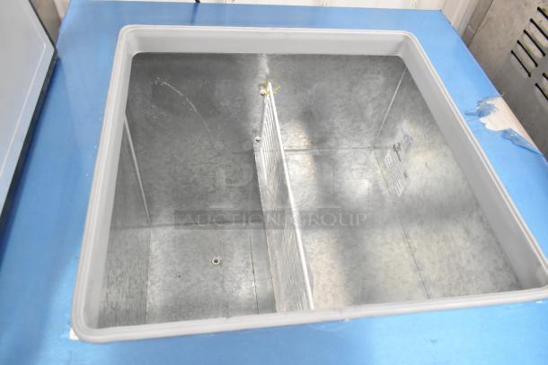 Brand new 2022 Master-Bilt DC-4D metal commercial chest freezer, 115V, 1 phase, open view, pristine condition.