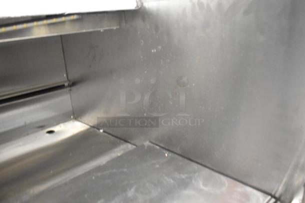 Stainless Steel Commercial Horizontal Open Grab N Go Merchandiser, interior view, slight wear, ideal for displaying products.