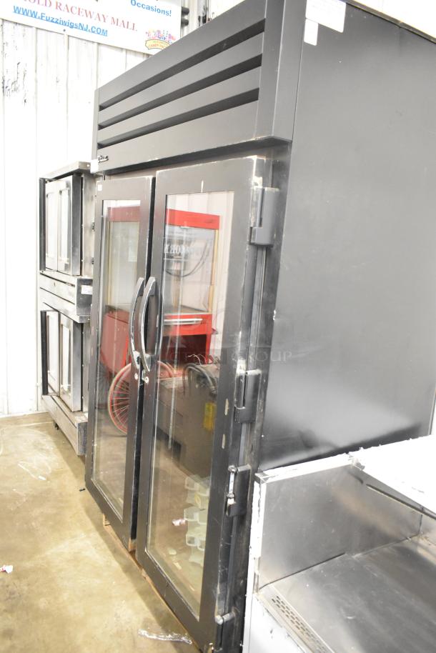 2020 True STG2RPTVLD-2G-2S-HC metal commercial cooler, 2 glass doors, poly-coated racks, 115V, 1 phase, good condition.