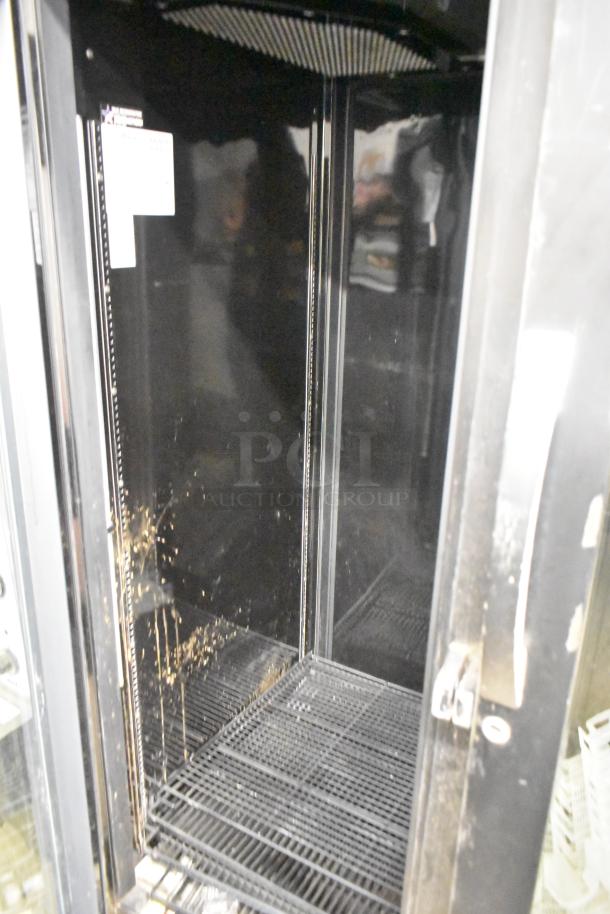 2020 True STG2RPTVLD-2G-2S-HC reach-in cooler, poly-coated racks, two doors, visible wear, commercial use.