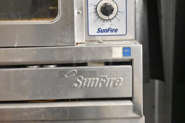 Two Garland SunFire stainless steel full-size convection ovens with view-through doors, metal racks, and thermostatic controls.