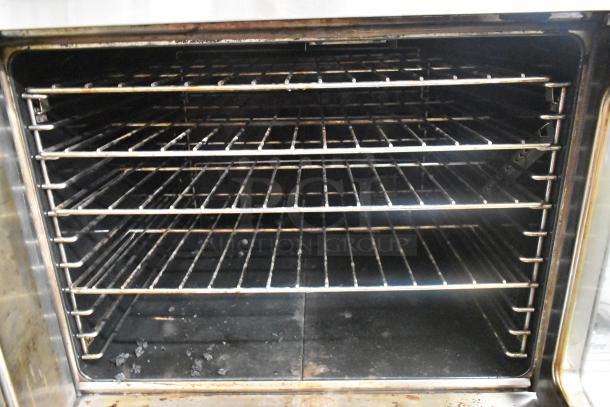 Garland SunFire stainless steel full-size convection oven with view-through doors, metal racks, and thermostatic controls.