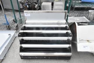 Brand new Regency 600LDR3024S stainless steel bottle merchandiser, no legs, with minor scratches. Tags indicate model.