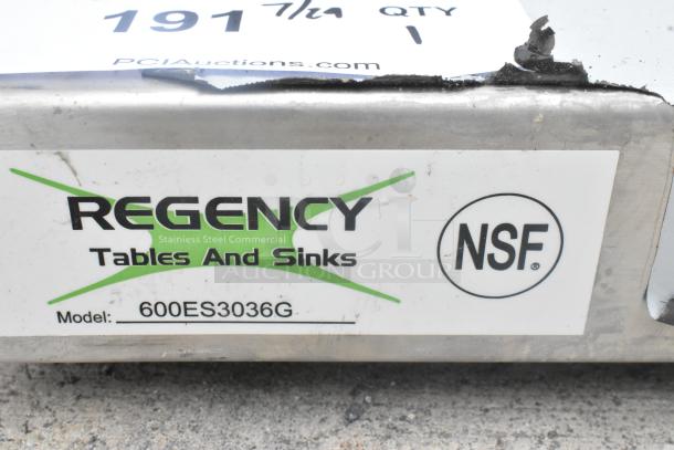 Brand new Regency 600ES3036G 30" x 36" stainless steel equipment stand, scratch and dent, with galvanized undershelf, no legs.