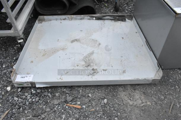 Regency 30"x36" 16-gauge stainless steel equipment stand, brand new, no legs, slight dents visible. Tag reads "193 017."