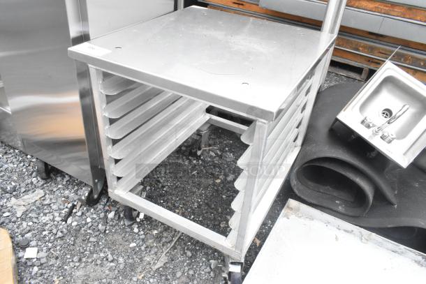 Brand new metal pan rack on commercial casters with minor scratches. Multiple shelves, sturdy design, ideal for kitchens.