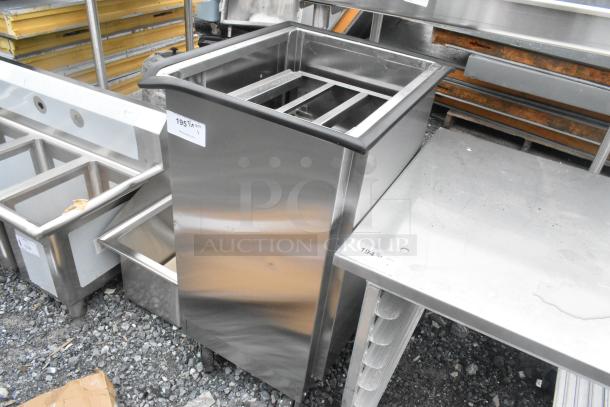 BRAND NEW Lakeside stainless steel tray return on commercial casters, with minor dents. Durable and mobile with metal finish.