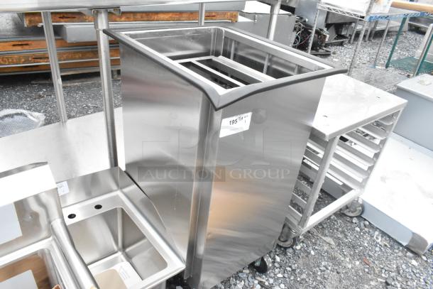 Lakeside stainless steel tray return on commercial casters, brand new scratch and dent, includes label with item details.