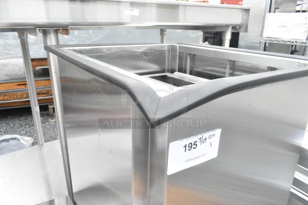 Lakeside stainless steel tray return on commercial casters, new, scratch and dent, with label "195" indicating auction lot.