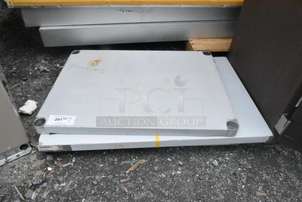 Brand new Regency 24"x36" 18-gauge stainless steel work table top, no legs, slight dent, commercial use, galvanized undershelf.