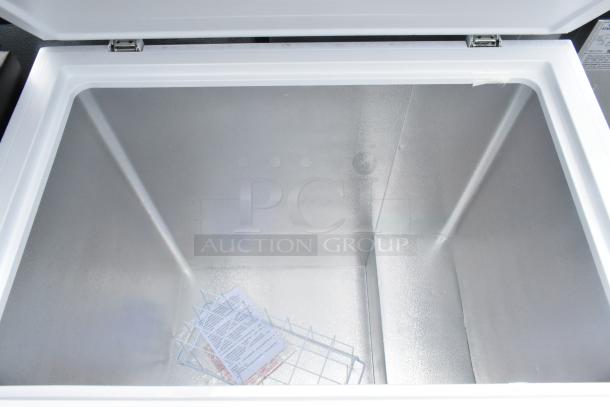 Hisense WFC070M6RWD chest freezer with open hinge lid, interior view, including wire basket and tags. 115V, 1 Phase.