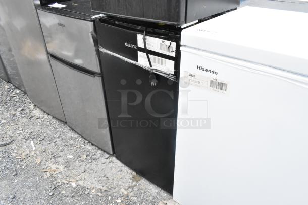 Galanz GLR33MBKE23 mini cooler, black, 115V, 2 gal. Some surface wear visible. Auction offers double your bid.