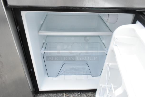 Galanz GLR31TSTE02 Mini Cooler with Freezer, 115V, 1 Phase. Features shelves, crisper drawer. Clean interior, good condition.