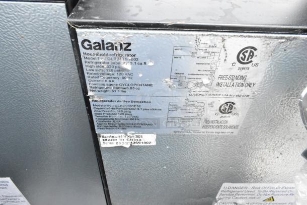 Galanz GLR31TSTE02 Mini Cooler with Freezer, 115V, 1 Phase, 3.1 cu. ft., silver finish. Tag shows model specifications and "Made in China."