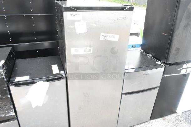 Frigidaire EFRF698-6COM single door freezer, silver finish, 115 volts, 1 phase, visible brand label, minor surface wear.