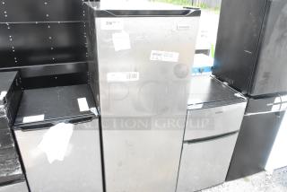 Frigidaire EFRF698-6COM single door freezer, silver finish, 115 volts, 1 phase, visible brand label, minor surface wear.